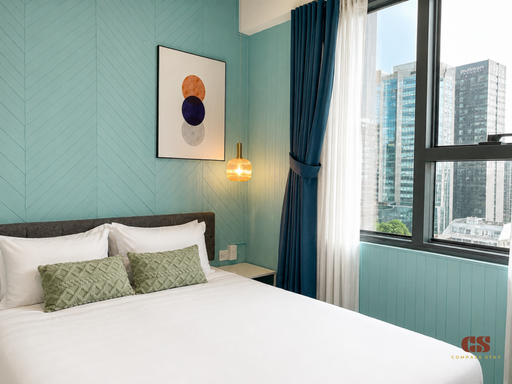 Two-bedroom serviced apartment in District 1 HCMC with a private living room for long-stay guests.