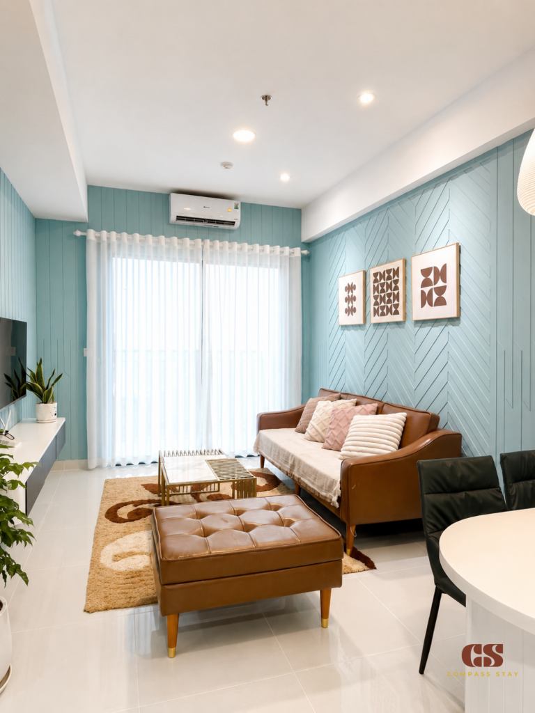 Quiet serviced apartment bedroom with natural light and a work area for digital nomads in District 1 HCMC