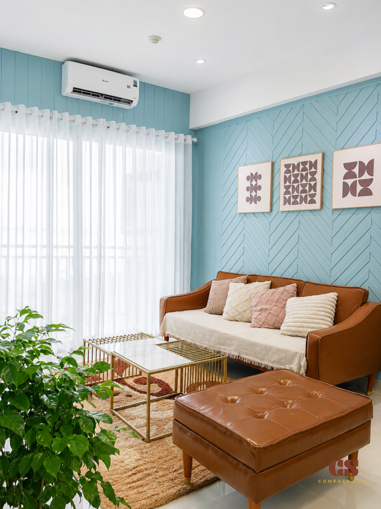 Quiet serviced apartment bedroom with natural light and a work area for digital nomads in District 1 HCMC